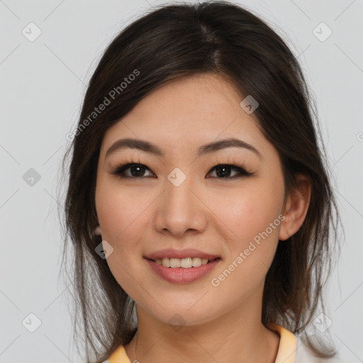 Joyful asian young-adult female with medium  brown hair and brown eyes