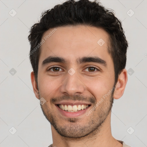 Joyful white young-adult male with short  black hair and brown eyes