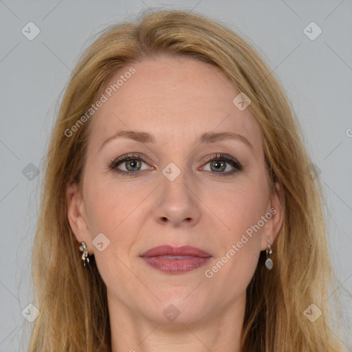 Joyful white adult female with long  brown hair and brown eyes