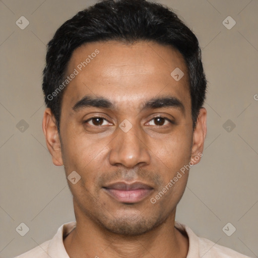 Joyful latino young-adult male with short  black hair and brown eyes