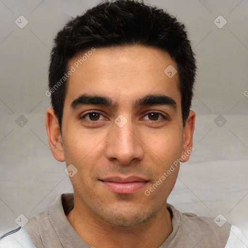 Joyful white young-adult male with short  black hair and brown eyes