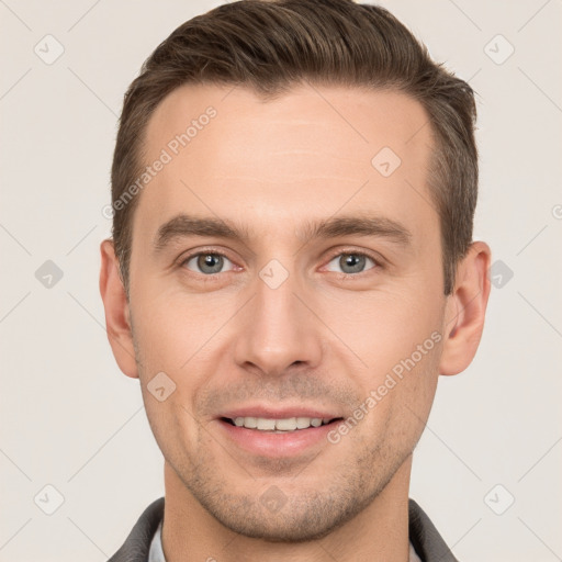 Joyful white young-adult male with short  brown hair and brown eyes