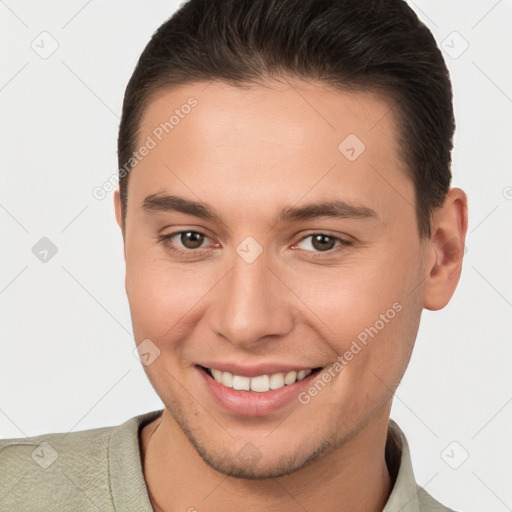 Joyful white young-adult male with short  brown hair and brown eyes