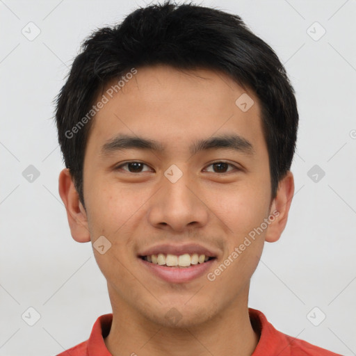 Joyful asian young-adult male with short  brown hair and brown eyes