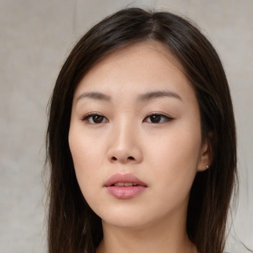 Neutral white young-adult female with long  brown hair and brown eyes
