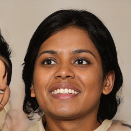 Joyful asian young-adult female with medium  black hair and brown eyes