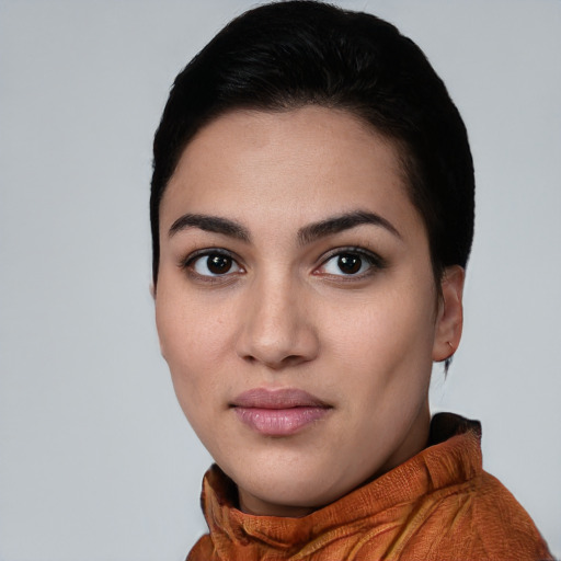 Joyful white young-adult female with short  black hair and brown eyes