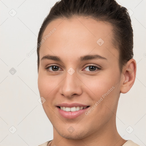 Joyful white young-adult female with short  brown hair and brown eyes