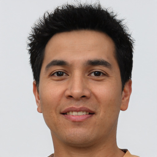 Joyful asian young-adult male with short  black hair and brown eyes