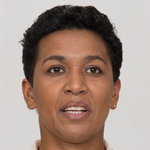 Joyful latino adult female with short  brown hair and brown eyes
