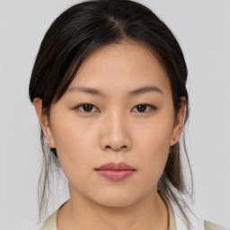 Neutral asian young-adult female with medium  brown hair and brown eyes