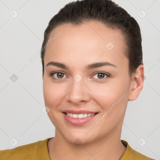 Joyful white young-adult female with short  brown hair and brown eyes