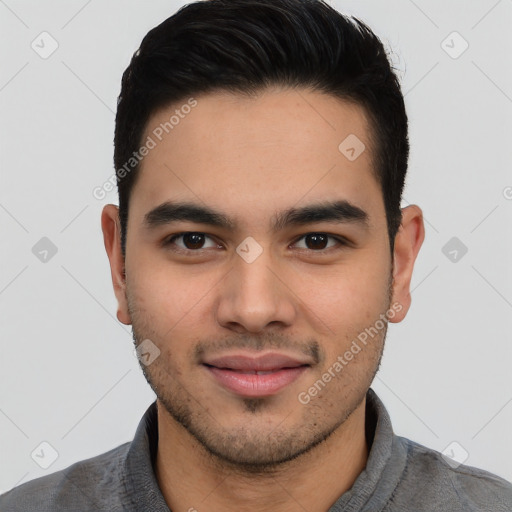 Joyful latino young-adult male with short  brown hair and brown eyes