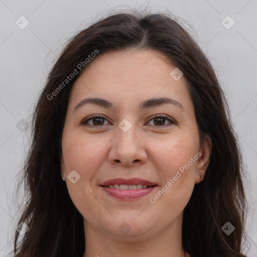 Joyful white adult female with long  brown hair and brown eyes