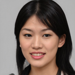 Joyful asian young-adult female with medium  black hair and brown eyes