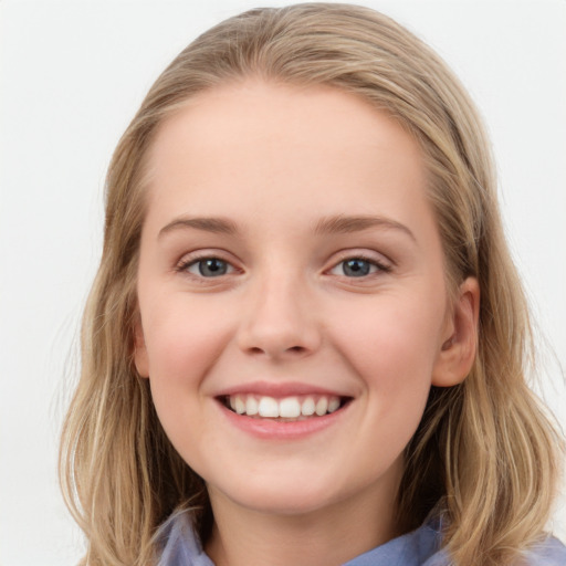 Joyful white young-adult female with medium  brown hair and blue eyes