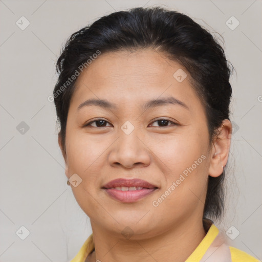 Joyful asian young-adult female with short  brown hair and brown eyes