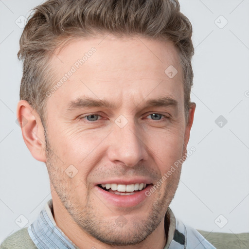 Joyful white adult male with short  brown hair and grey eyes