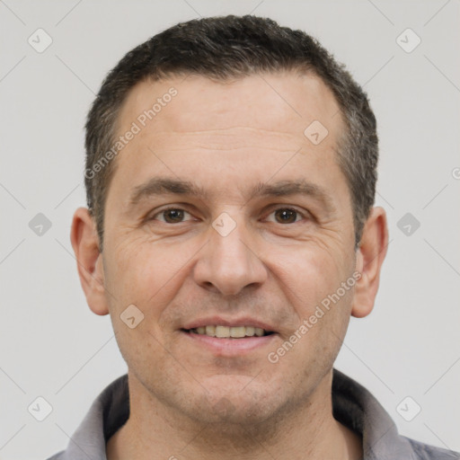 Joyful white adult male with short  brown hair and brown eyes