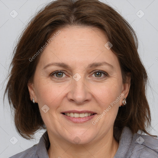 Joyful white adult female with medium  brown hair and grey eyes