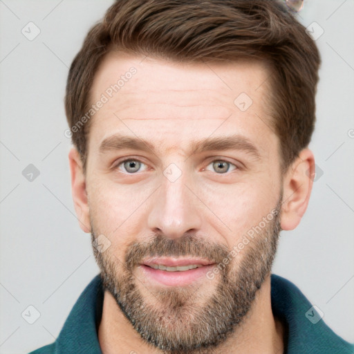 Joyful white adult male with short  brown hair and grey eyes