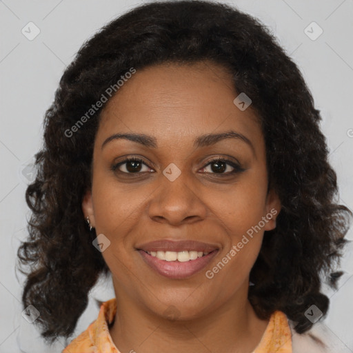 Joyful black young-adult female with medium  brown hair and brown eyes