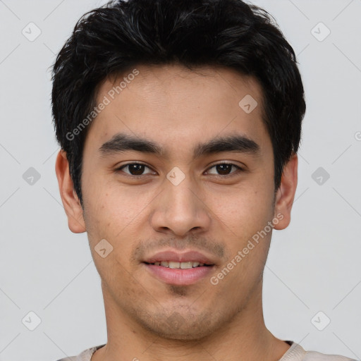 Joyful asian young-adult male with short  brown hair and brown eyes