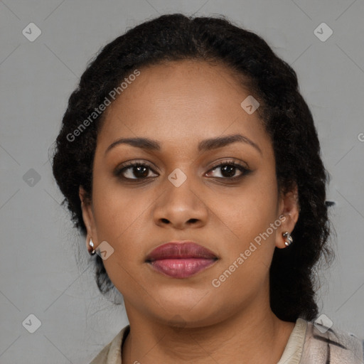 Joyful black young-adult female with long  brown hair and brown eyes