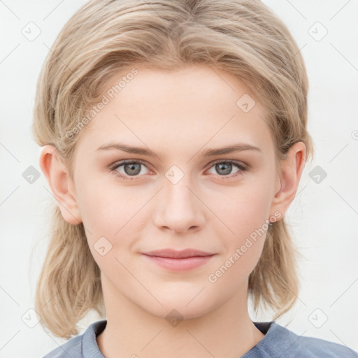 Joyful white young-adult female with medium  brown hair and blue eyes