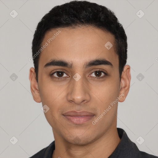 Joyful latino young-adult male with short  black hair and brown eyes