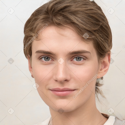 Joyful white young-adult female with medium  brown hair and grey eyes