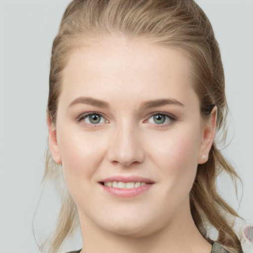 Joyful white young-adult female with long  brown hair and blue eyes