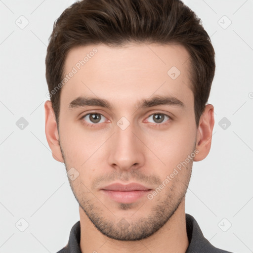 Neutral white young-adult male with short  brown hair and brown eyes