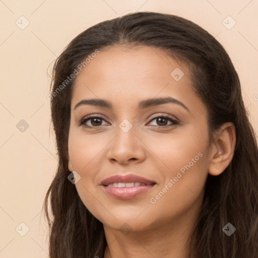 Joyful latino young-adult female with long  brown hair and brown eyes