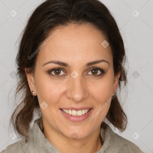 Joyful white adult female with medium  brown hair and brown eyes