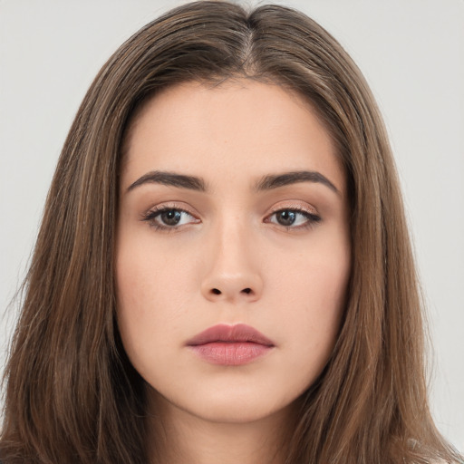 Neutral white young-adult female with long  brown hair and brown eyes