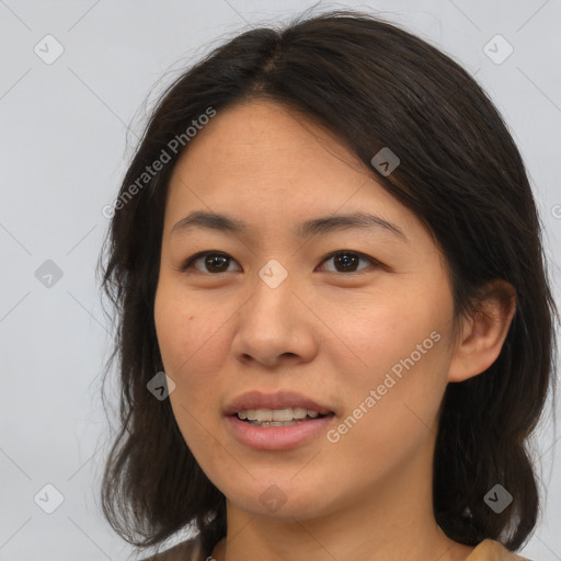 Joyful asian young-adult female with medium  brown hair and brown eyes