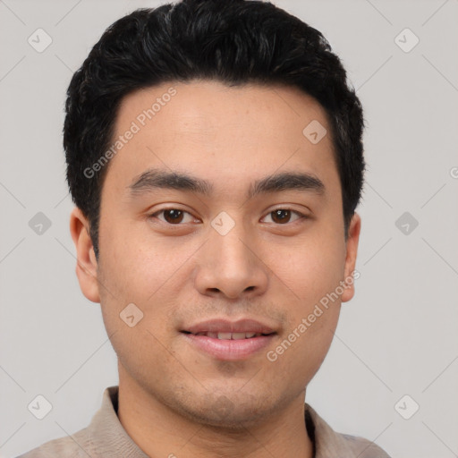 Joyful asian young-adult male with short  black hair and brown eyes