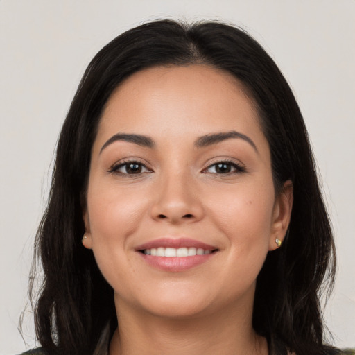 Joyful white young-adult female with long  black hair and brown eyes