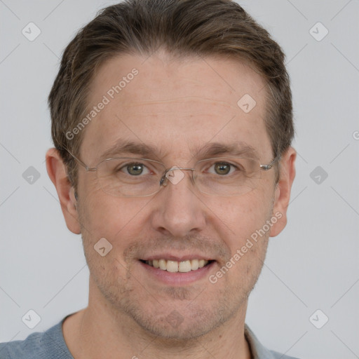 Joyful white adult male with short  brown hair and grey eyes