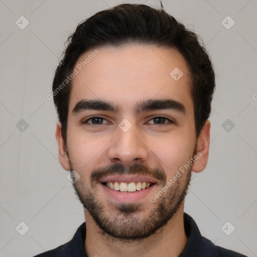 Joyful white young-adult male with short  black hair and brown eyes