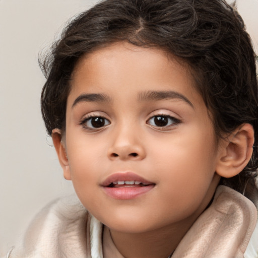 Joyful white child female with long  brown hair and brown eyes