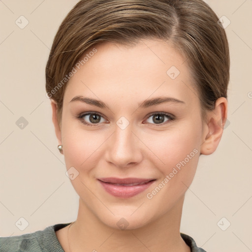 Joyful white young-adult female with short  brown hair and grey eyes