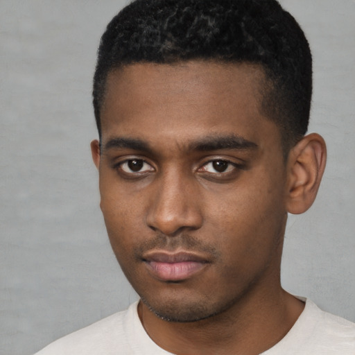 Neutral black young-adult male with short  black hair and brown eyes