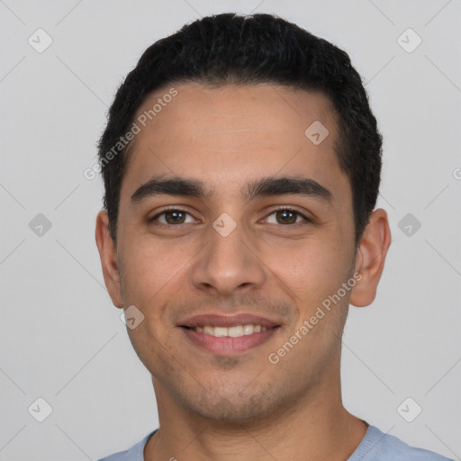 Joyful white young-adult male with short  black hair and brown eyes