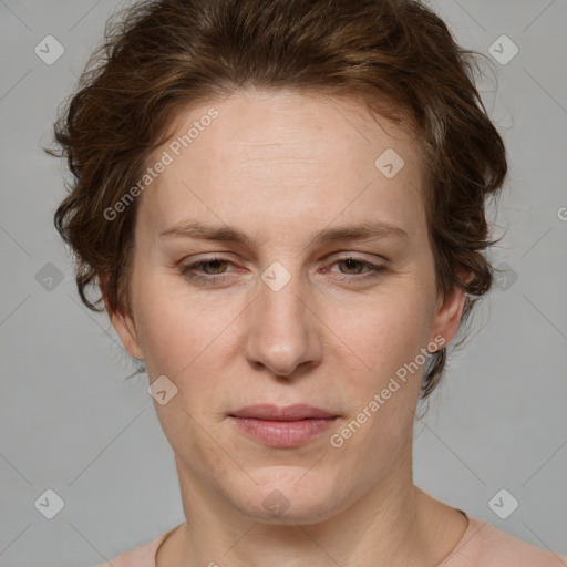 Joyful white adult female with short  brown hair and grey eyes