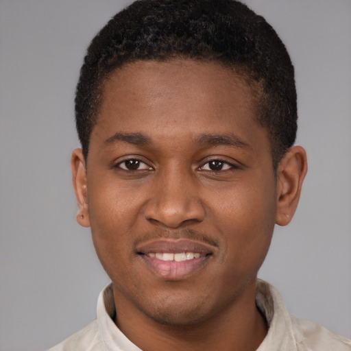 Joyful latino young-adult male with short  brown hair and brown eyes