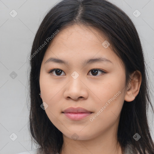 Joyful asian young-adult female with long  brown hair and brown eyes