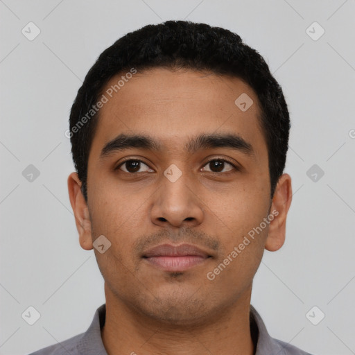 Neutral latino young-adult male with short  black hair and brown eyes