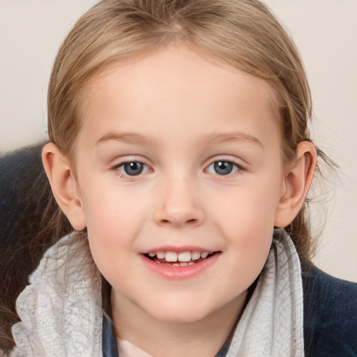 Joyful white child female with medium  brown hair and grey eyes